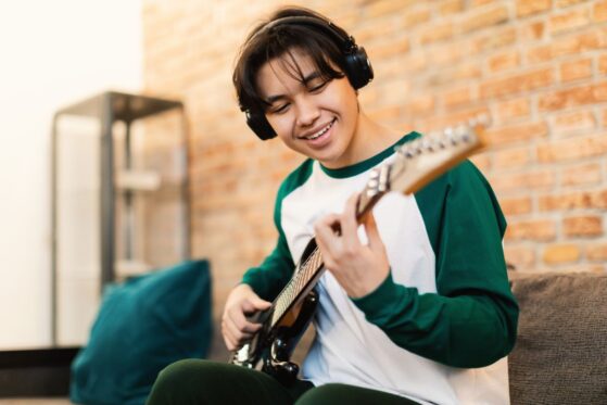 boy playing guitar