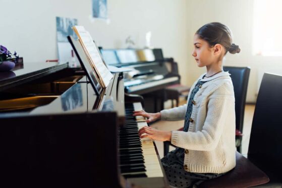 girl playing piano