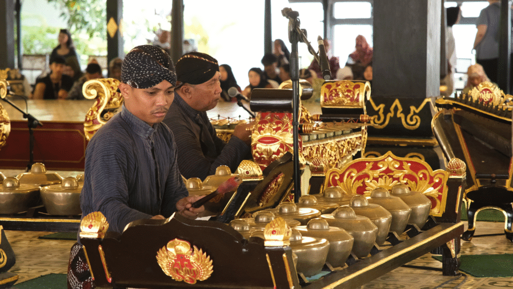 "Musicians playing traditional Gamelan instruments in Indonesia, showing the transformative power of music in cultural expression and community connection."