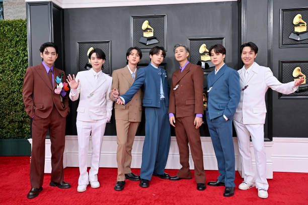 BTS posing together on the red carpet at the Grammy Awards — BTS & The K-Pop Band That Conquered the World.