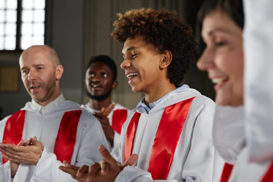 Church choir singing and clapping hands