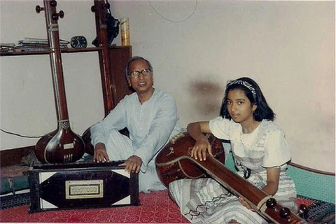 Young Shreya Ghoshal learning classical music with her teacher during early training—Shreya Ghoshal childhood and music journey.