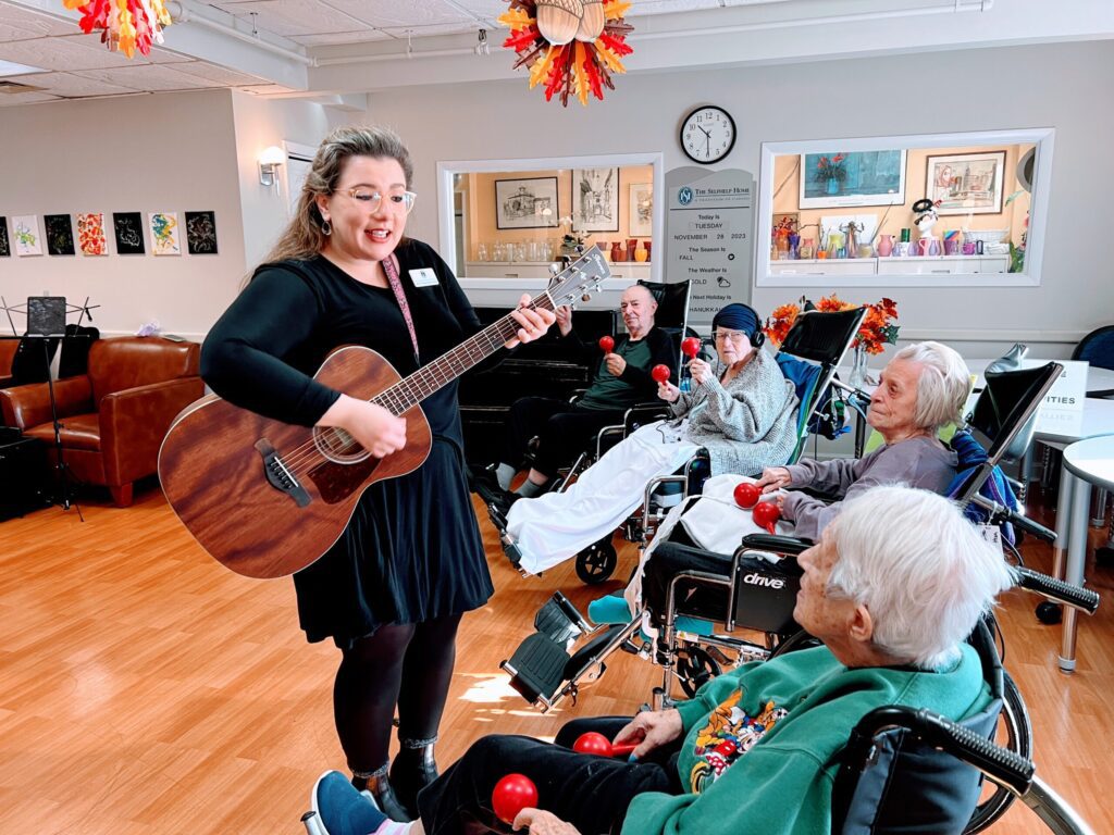 Patient moving to rhythm during therapy session – music in medicine for rehabilitation.