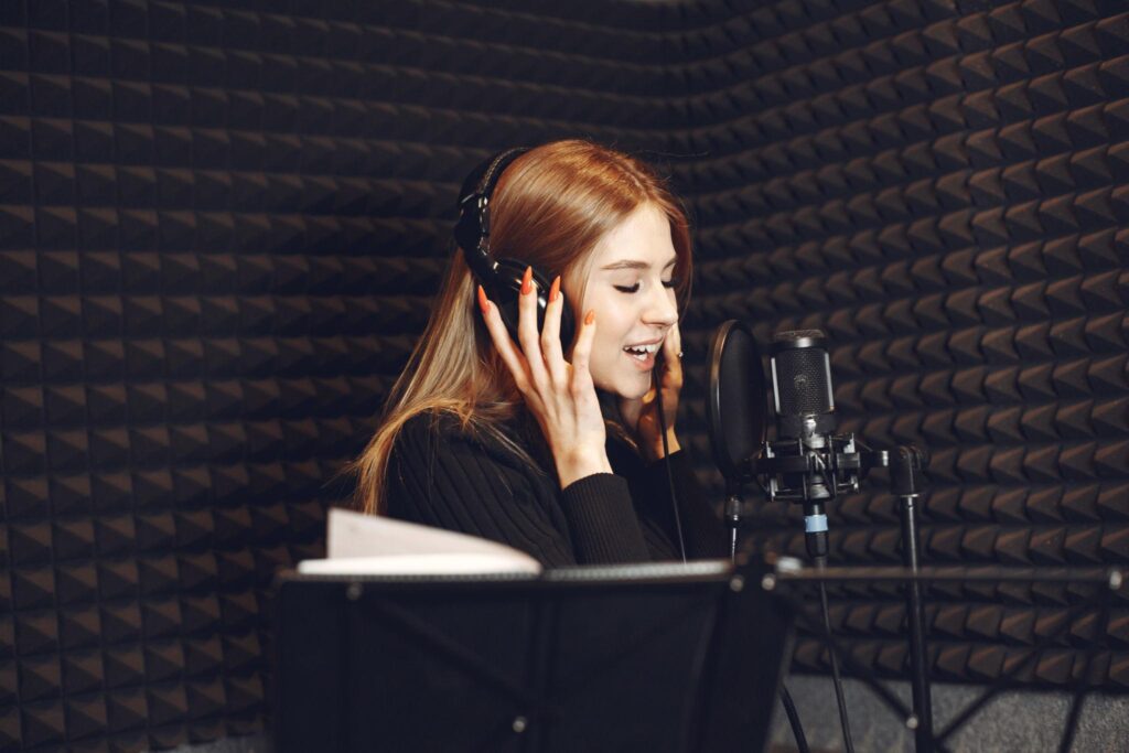 Singer practicing vocal technique and breathing with microphone