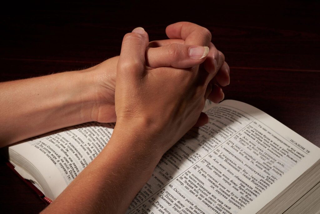Worship leader praying alone in church before leading