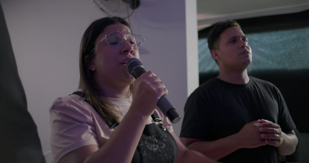 Worship leader singing with emotion Singing with Purpose