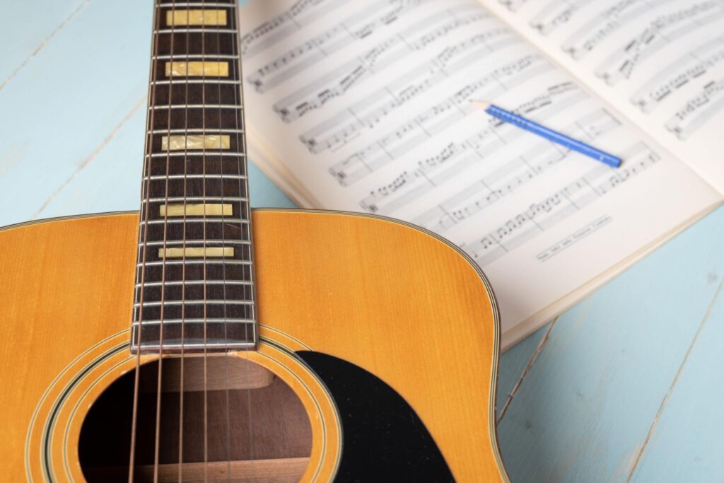 Guitar live performance chord progression analysis on sheet music.