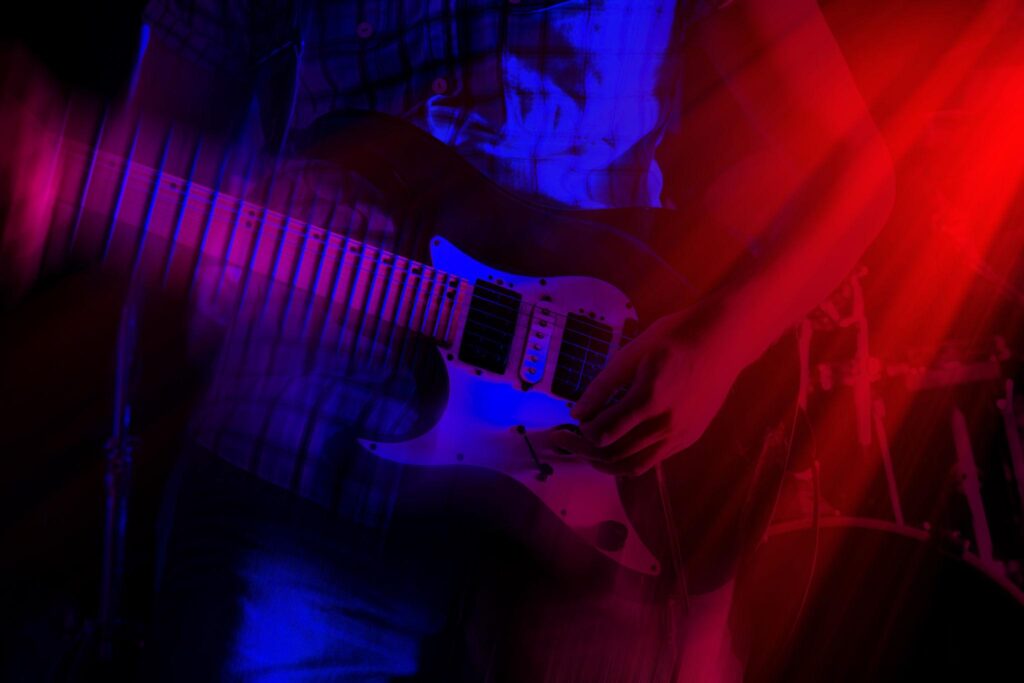 Why Many Guitarists Have Great Speed but Poor Timing — close-up of hands playing rhythm guitar chords accurately.
