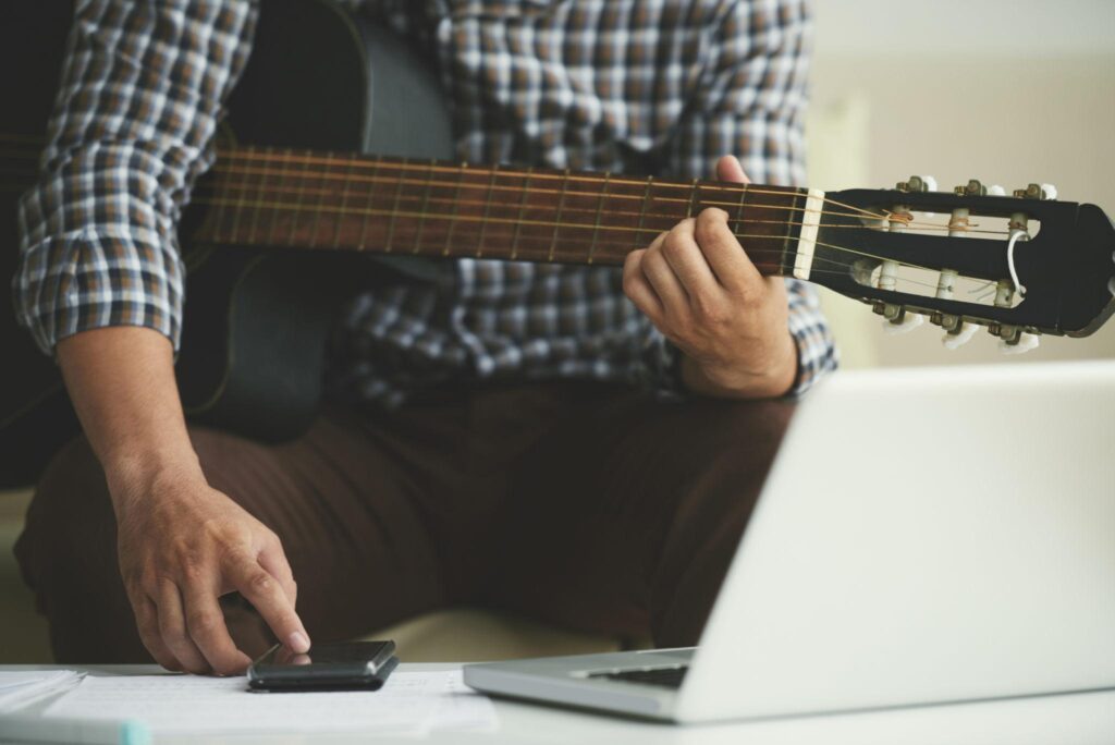 Guitar live performance fingerstyle practice close-up.