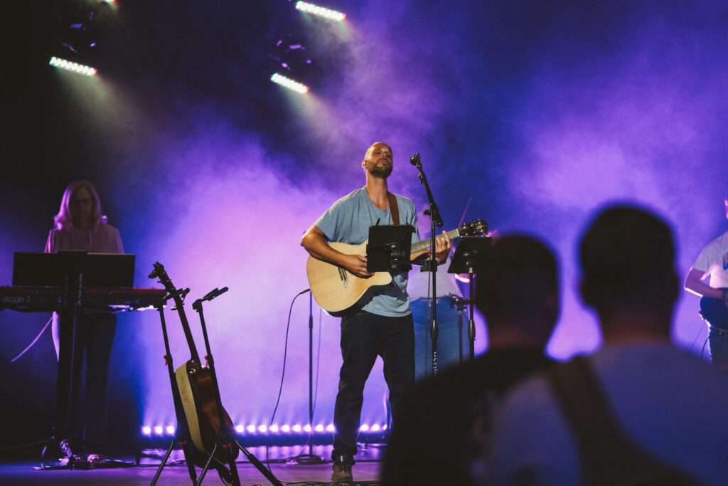 A worship chord progression practice setup with guitar chords and musical notes, illustrating smooth transitions between worship chords for beginners.
