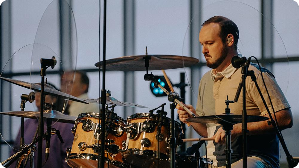 Best Instruments for Worship Music – church drummer maintaining rhythm during a worship service.