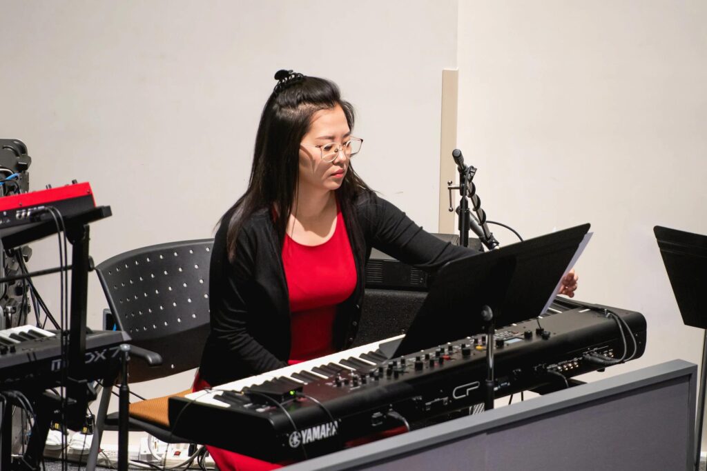Worship pianist praying before leading church worship.