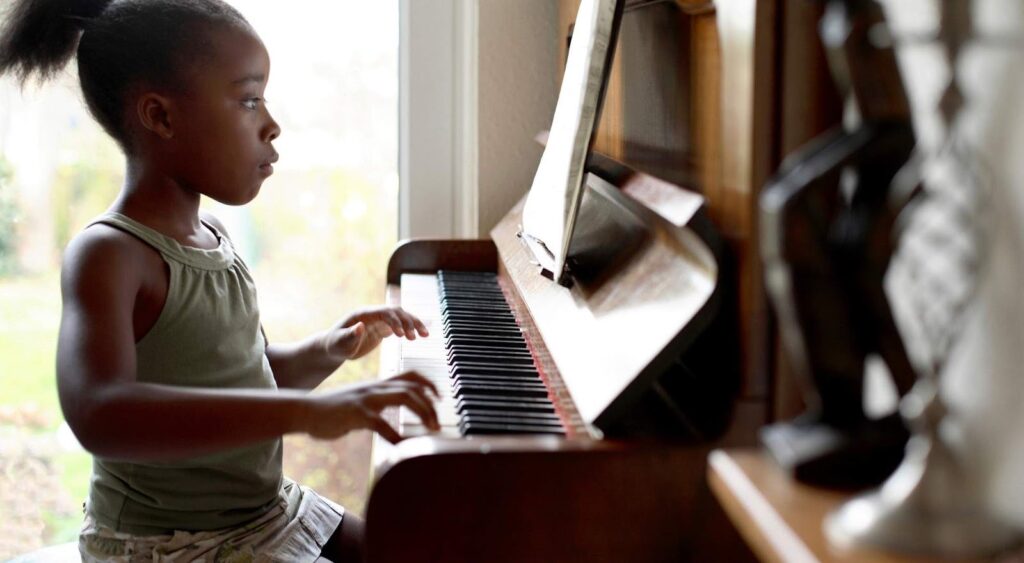 kid playing piano