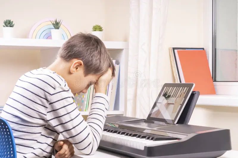 student practicing piano with busy schedule