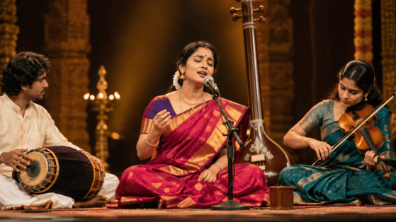 Carnatic vocalist performing with violin and mridangam during a concert, illustrating improvisation in Carnatic music